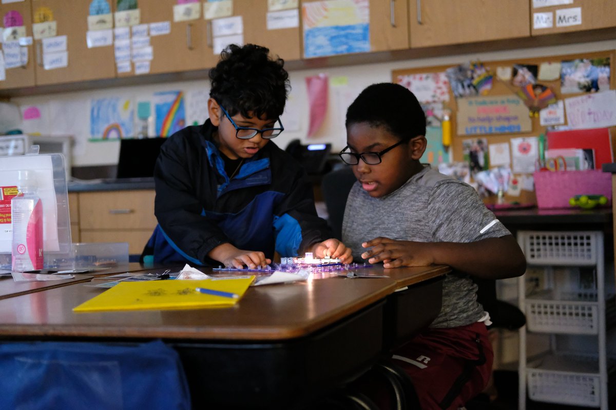 HSSD's tweet image. Howard second graders are filling the school with light! As they are learning about energy, they are using snap circuits to power lightbulbs. #AuthenticLearning #InnovativeProgramming