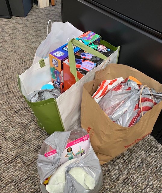 UMassLawLibrary's tweet photo. Thanks to all who left toys and clothes under the book tree.  Your donations were delivered to MC on Fri.  Next stop is into the homes of local kids! TY for your generosity!  #umasslaw https://t.co/odP0xzyEmh