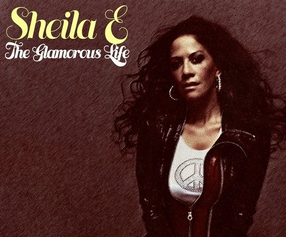 OneHitWenger's tweet photo. „Ein glanzvolles Leben, eine bizarre Liebe“: US-Schlagzeugerin und Sängerin #Sheila #Cecilia #Escovedo (@SheilaEdrummer) aus #Oakland, #Kalifornien, wird heute 65, #HappyBirthday! Der Ex-Verlobten von @SantanaCarlos und @Prince gelangen 1984/85 diesen beiden Single-Hits. https://t.co/8J7TE7KNHA