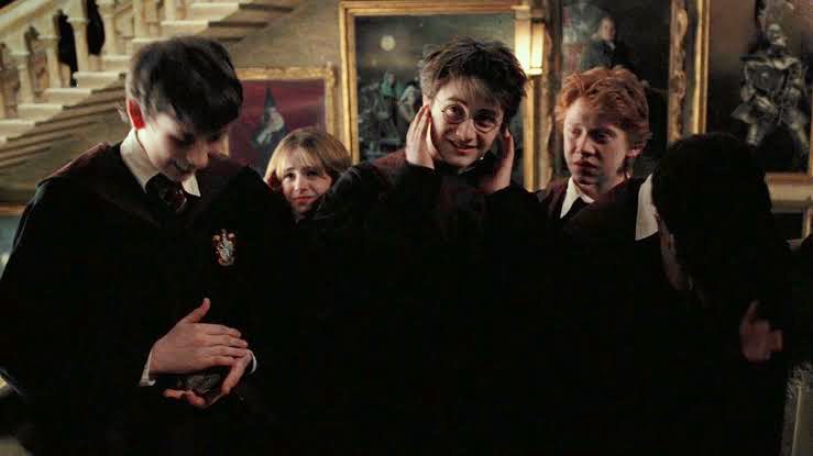 HARRYP0TTERING's tweet photo. the fact that everyone is covering their ears to block out the fat lady singing while neville is there covering trevor's instead of his own, cant put into words how much i love him its unbelievable https://t.co/nipCOO7wPS