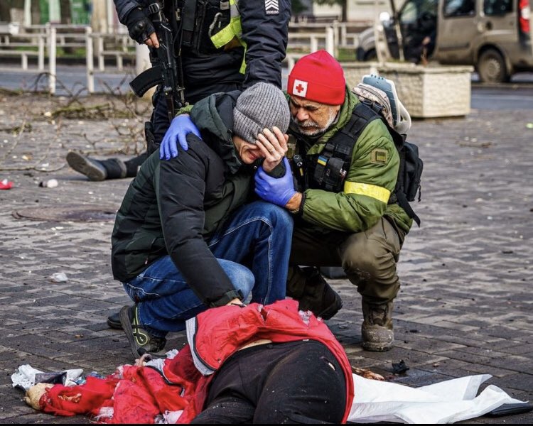 A man tries to comfort a woman who has just lost her sister to a Russian artillery strike against the main market in the city of Kherson. 

The picture was taken yesterday.