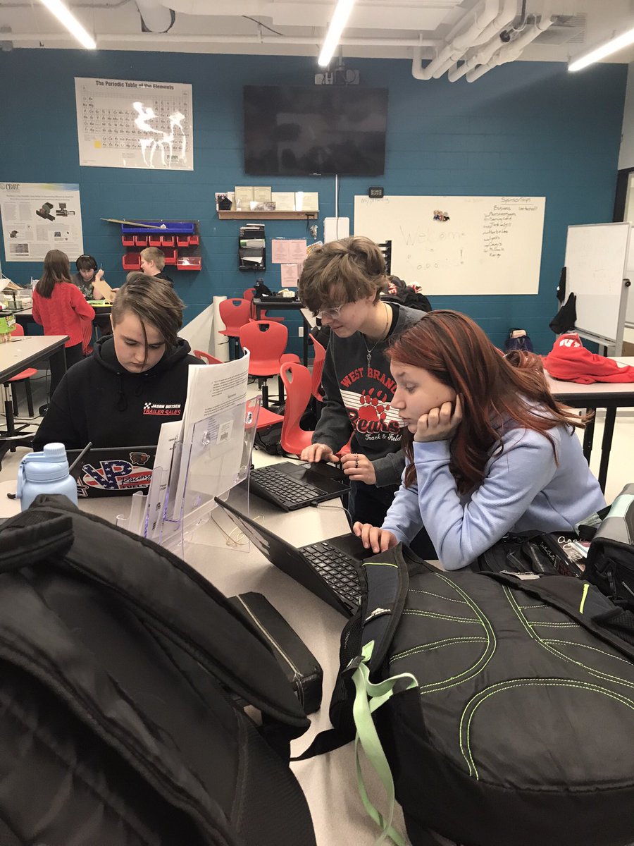 Three students working on our annual report!!