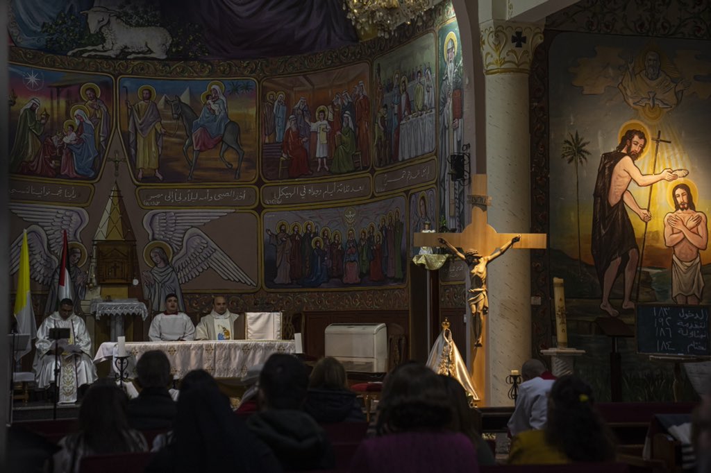 Palestinian Christian worshipers pray on Christmas Eve at the Holy Family Catholic Church in Gaza City. (AP Photo/Fatima Shbair)