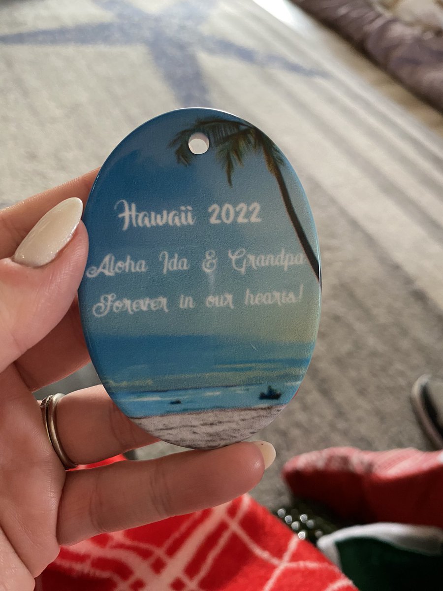 evannmk's tweet photo. My MIL got us ornaments to commemorate a cruise we went on but didn’t know it came with an option to personalize. So instead of a picture of my husband’s late grandparents, it’s a stock photo. So, merry Christmas to these models and thank you for an absolutely amazing memory https://t.co/DICzNYfHOA