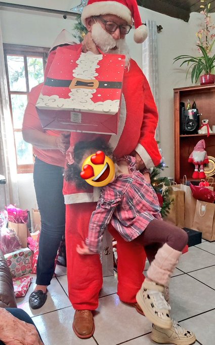 I like how my grandpa still dresses up a Santa for the only kid in the house, my little cousin https://t
