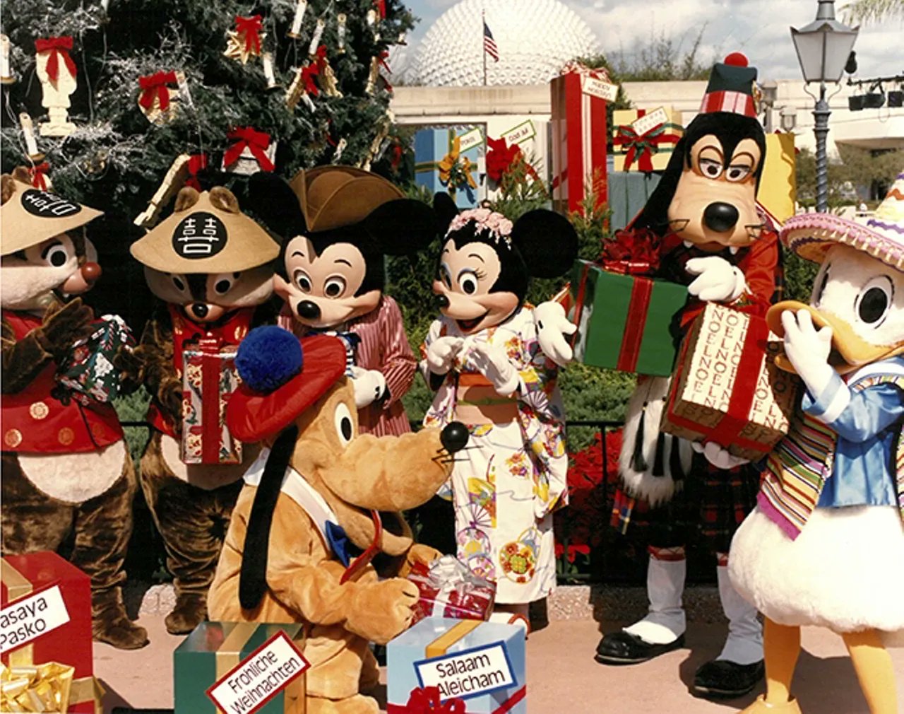 History@Disney on X: Mickey Mouse and friends celebrating Christmas at  EPCOT in traditional clothing of some of the countries that are represented  around World Showcase.  / X