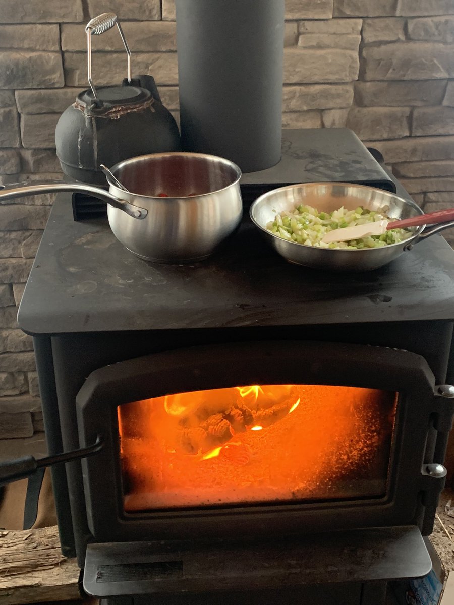 Power out for the last 23 hours and counting, so we are improvising using the wood stove to cook up some of the  Christmas dinner while the generator works OT to keep the rest of the house running.