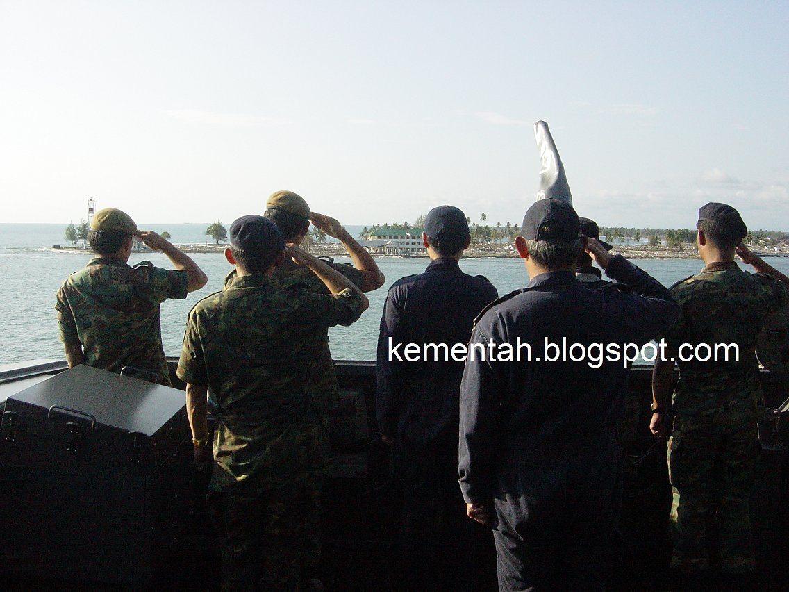 Singapore Armed Forces officers from the army and navy salute Meulaboh, Indonesia, as the LST RSS Endurance sets course for home.