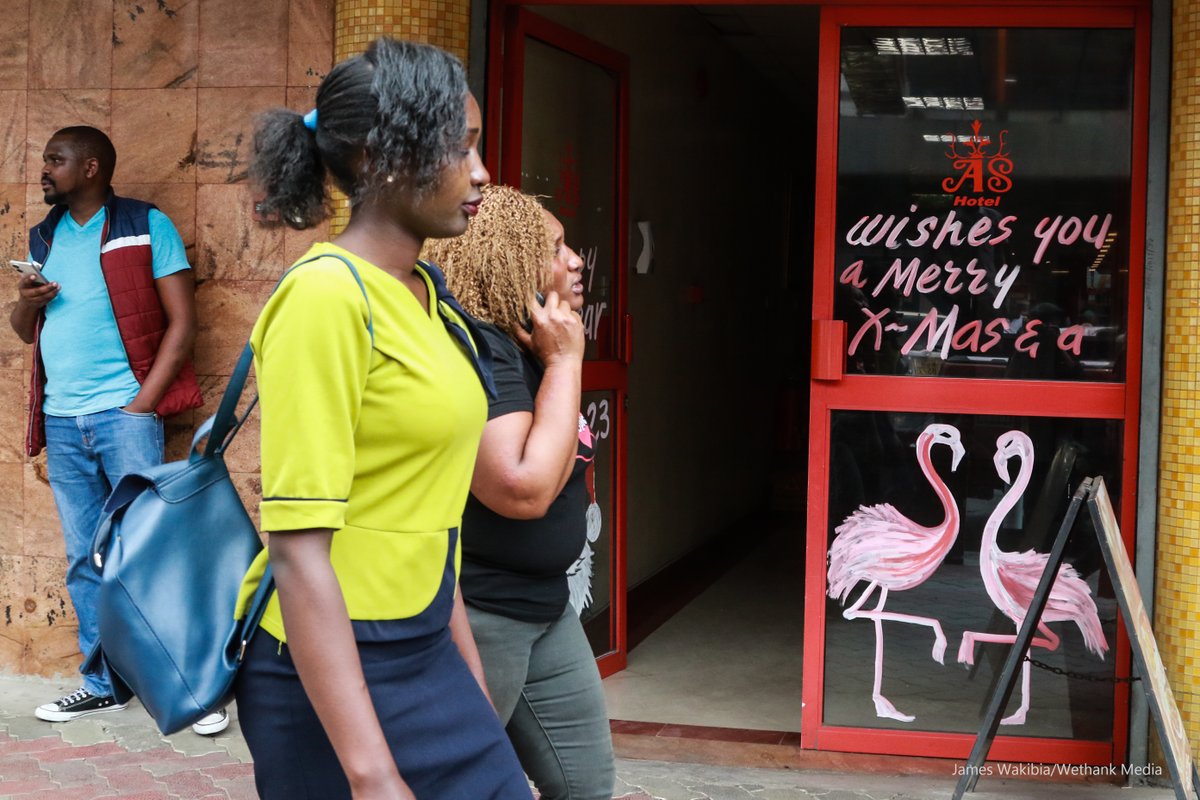 wethankmedia's tweet photo. Women walk past a hotel entrance with Christmas decorations in Nakuru Town. Cost of food remains high despite a slight drop in country's inflation which stood at 9.5% in November compared to 9.6% in the previous month. https://t.co/yD0OQrhKKc