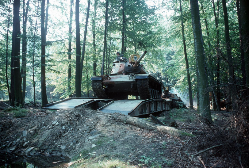 Korean_DMZ_Vets's tweet photo. Tank Tuesday Eve - M60A1 Pattons crossing a AVLB bridge, believe it is in Germany during the early 1980s! Hard to read the bumper numbers! #tanks #armor #tanktuesday #tanklover #ilovetanks #m60patton #m60a1 #coldwar #avlb https://t.co/qMvCE6Pztu