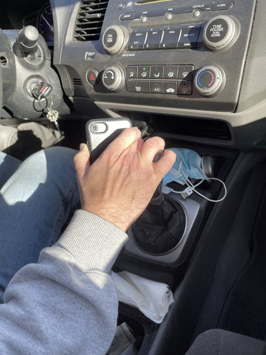 my dad wont get a phone mount for his car so this is how he holds it while driving (manual)