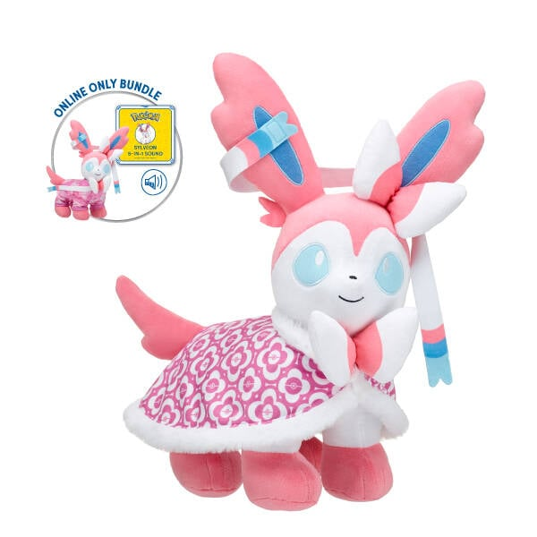 pokejungle's tweet photo. Fans in the UK can order the online-exclusive Sylveon bundle from Build-A-Bear! Features a pink cape, PJ sleeper and sound box. Check it out at our affiliate link: https://t.co/1fkqx0VNey https://t.co/z8kYmuZU8X