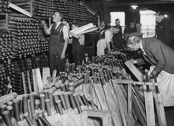 PictureSporting's tweet photo. In the days when cricket was the unrivaled summer game everyone wanted a cricket bat, and they were made locally and turned out in volume. This picture from 1935 shows the storage area at the Stuart Surridge factory in Borough High Street, Southwark (Picture Post) https://t.co/JZdIknHgVu