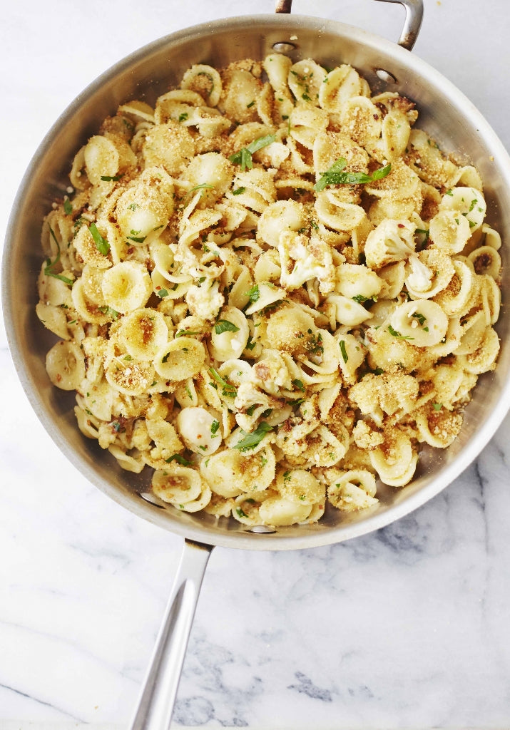 Giadzy's tweet photo. This pasta with cauliflower and breadcrumbs is a great dish to add to your weeknight dinner rotation. It's so easy and has great flavor from the toasted breadcrumbs, parmesan cheese, and anchovy filets.  https://t.co/aXMIkGUeS7 https://t.co/TMlOlwNQ53