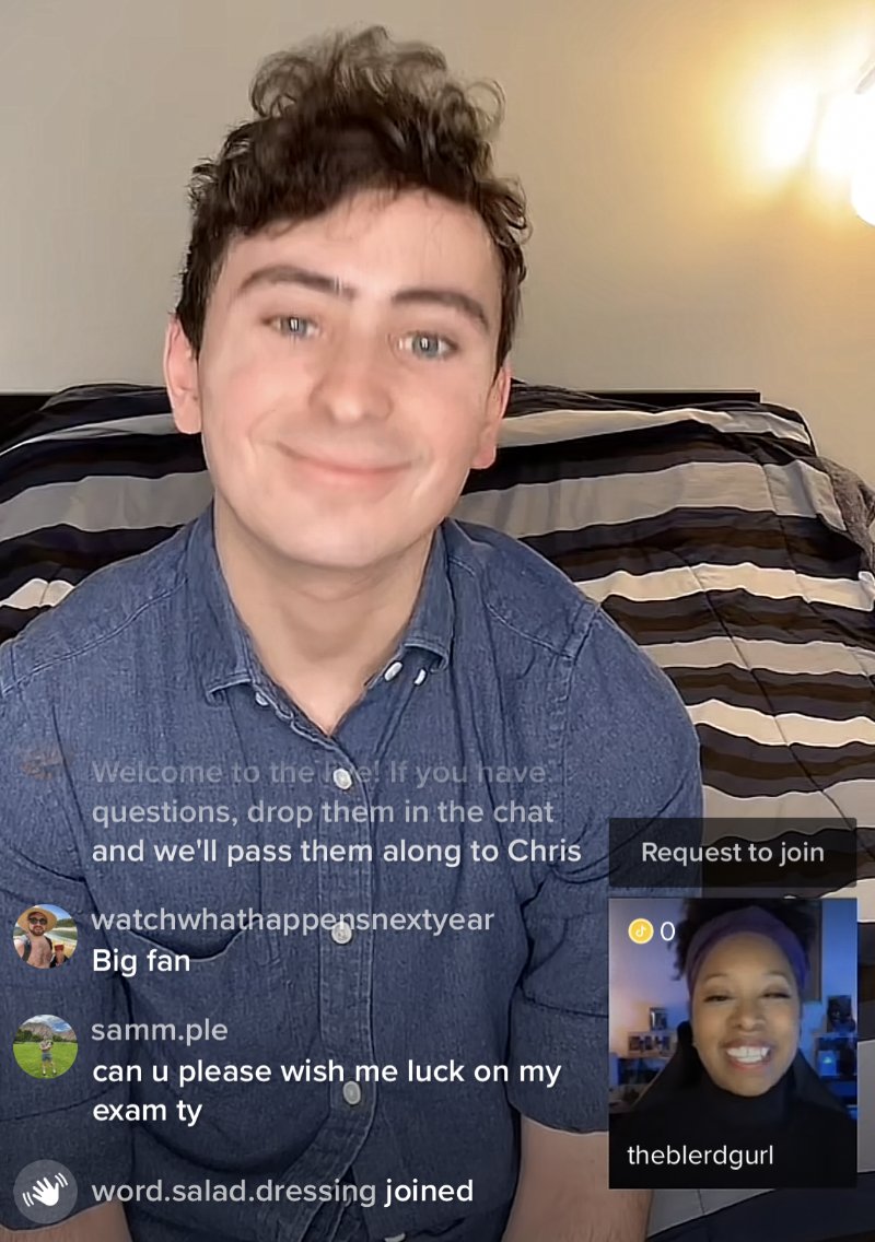 Just ByChrisVazquez and theblerdgurl smiling at each other