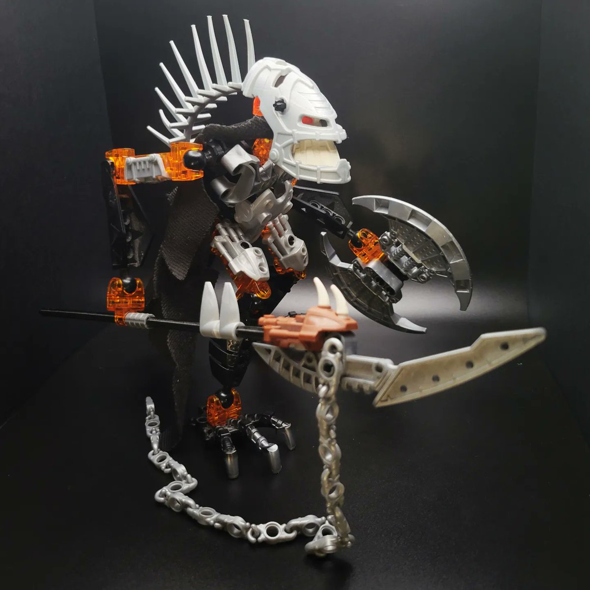 MorganRyanArt's tweet photo. 💀 Vezon 💀 A simple revamp inspired by the incredible artwork of @Prog_Ares . Since Vezon lives in a volcano I gave him trans orange lava legs. Has a cool spooky Halloween vibe. #bionicle #vezon #orange #moc https://t.co/6LqJEwGnZi