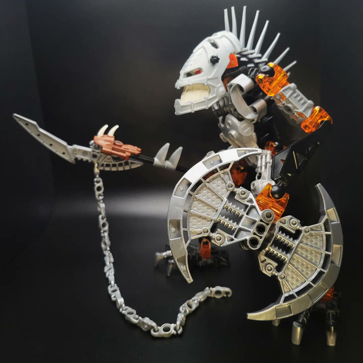MorganRyanArt's tweet photo. 💀 Vezon 💀 A simple revamp inspired by the incredible artwork of @Prog_Ares . Since Vezon lives in a volcano I gave him trans orange lava legs. Has a cool spooky Halloween vibe. #bionicle #vezon #orange #moc https://t.co/6LqJEwGnZi