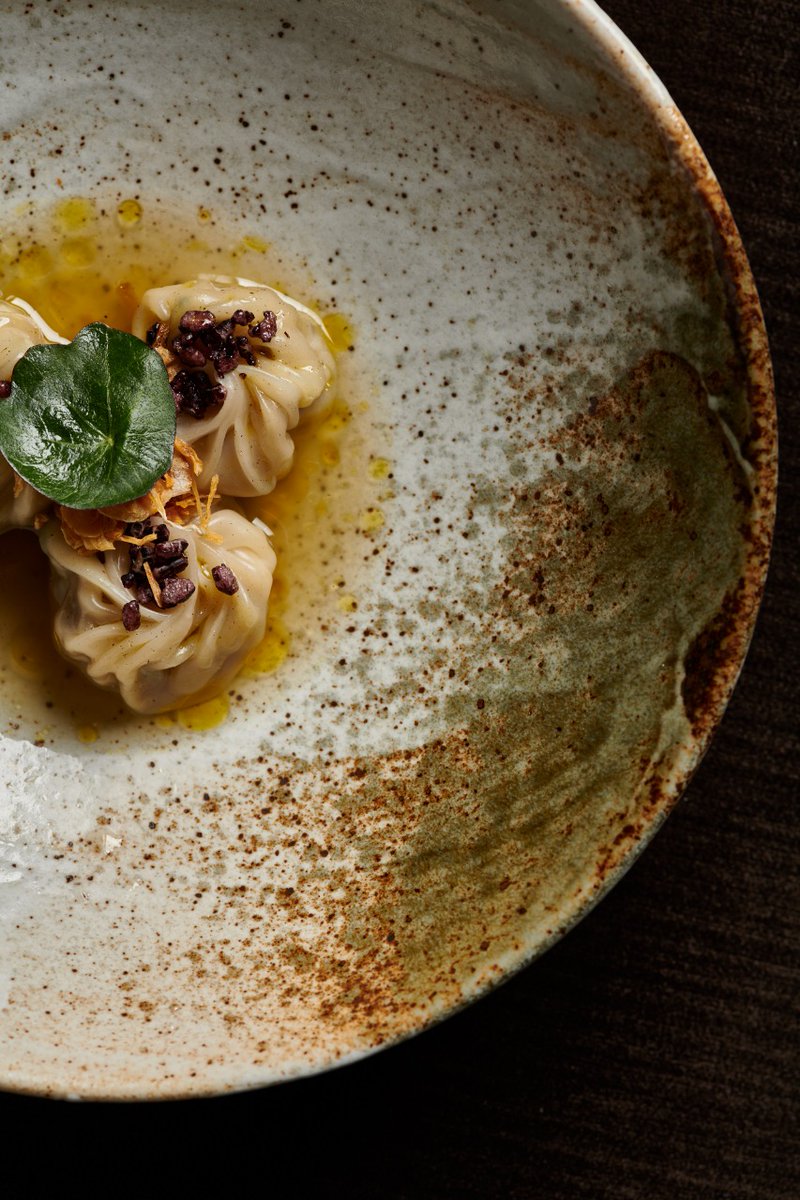 assamese pork dumplings, broth, nettle oil, crispy rice. 

inspired by the famous pork and potato curry from Assam, a state north east of #india. 
#indianaccentnyc #inventiveindian #nyc #newyork