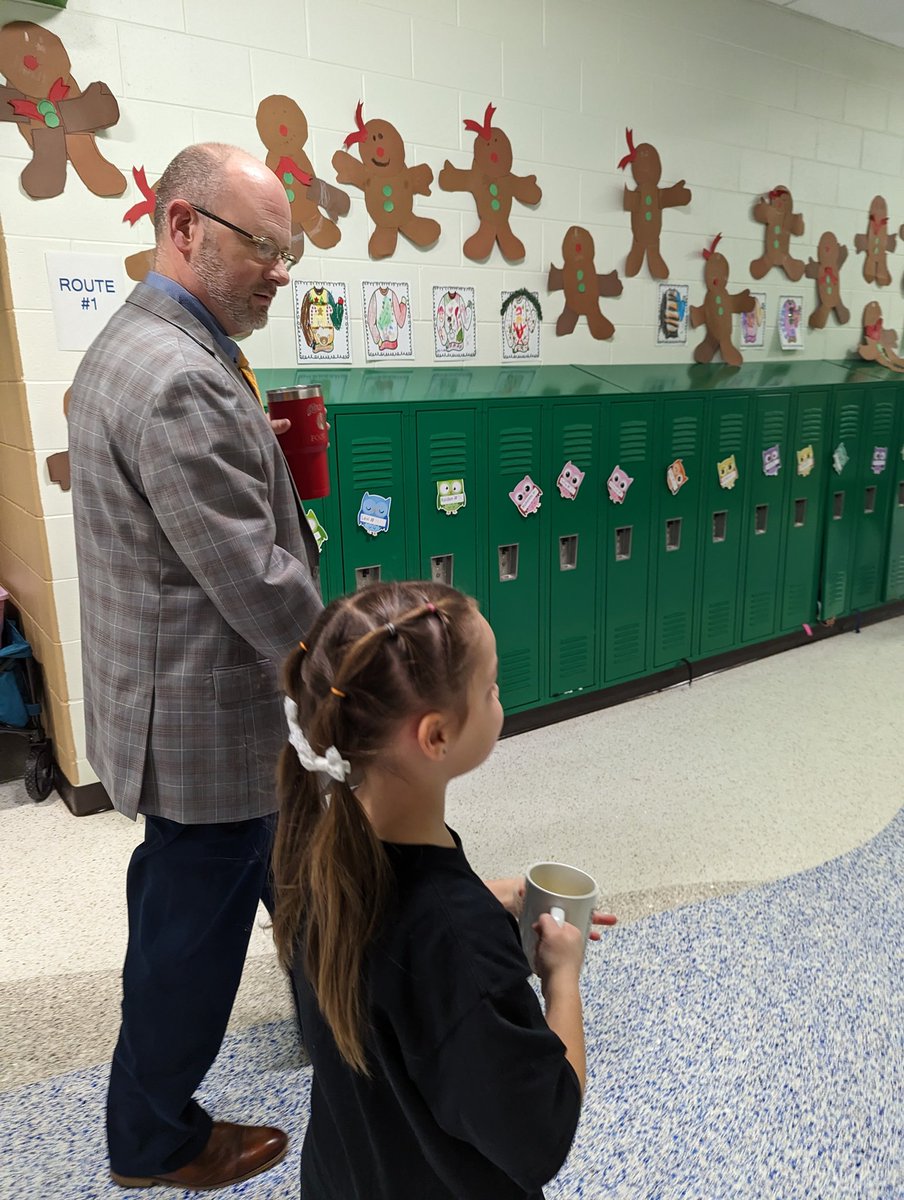 Principal for the Day Miss Maggie & Mr. Rowe @HuronSchoolDist discussing important beginning of day routines this morning.