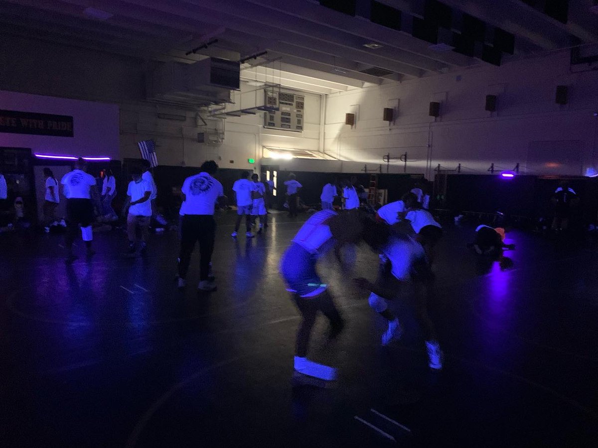 The #BandOfBrothers & #BandOfSisters lightened the mood with a great #BlacklightBonanza drill practice! 
#WrestlingIsFun
#Concrete 
#Process