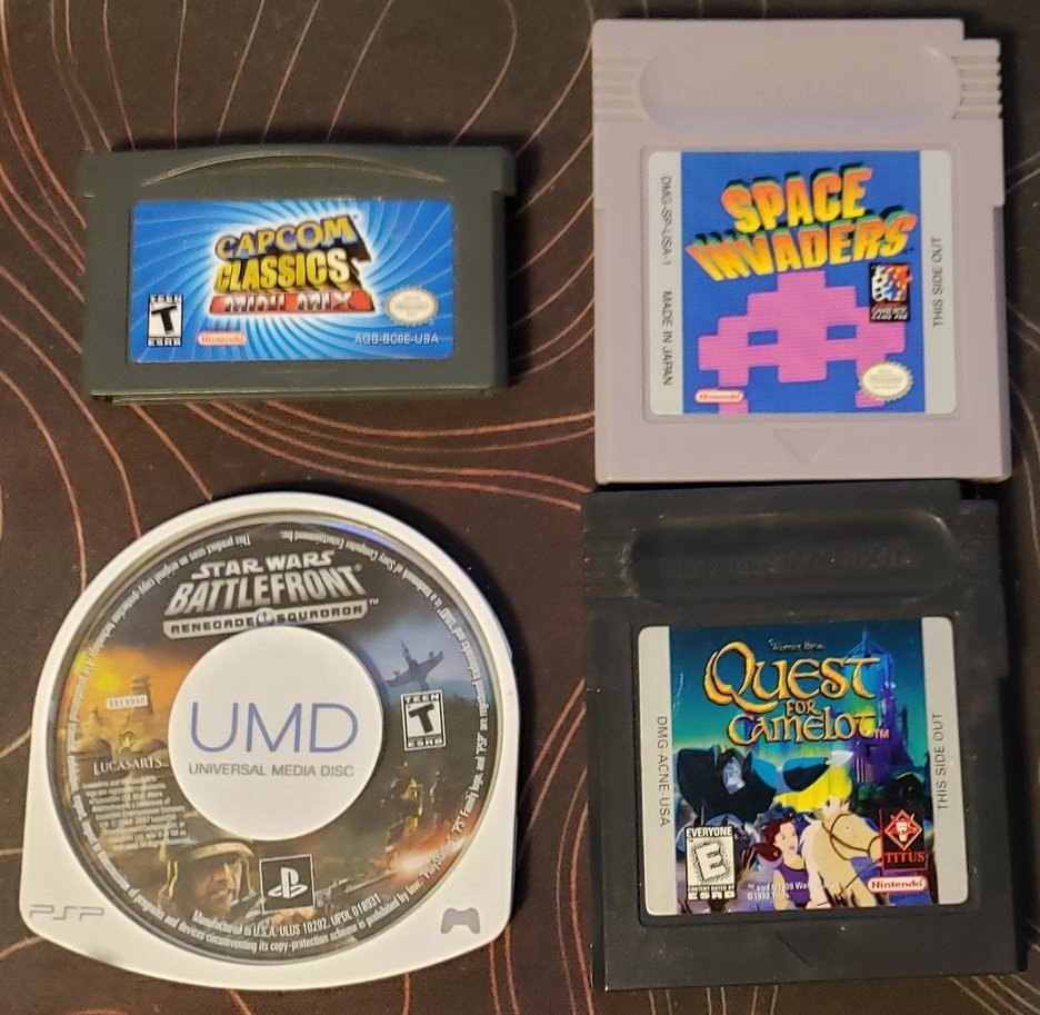 Brazbit's tweet photo. @ColonelFalcon @The_Top_Loader @Retrogamebrews @sincespacies @DANIELakaDEE @RetroBlastUS @Gamer_Dan5 @MaxLoki76 @TwinzDynamic @Solyant1 I reach into the shelf and grab a #Random4 games...
You can tell these were random by the inclusion of Quest for Camelot. Not a title I would have ever bought. I inherited it when my Mother-In-Law passed away. She had a rather eclectic collection of, mostly children's, games. ๐คทโโ๏ธ https://t.co/aa8CG47lPK