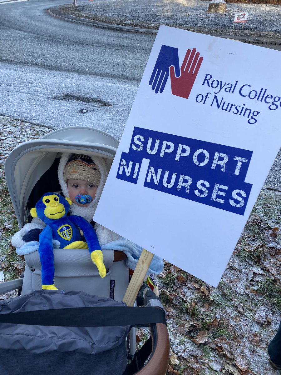 TrinaDoole's tweet photo. Me and my wee man on the Picket Line at Antrim today! 💙 @RCN_NI @theRCN #EnoughlsEnough #SafeStaffingSavesLives #FairPayForNurses #ProtectOurNHS https://t.co/mBfwOiWI2Q