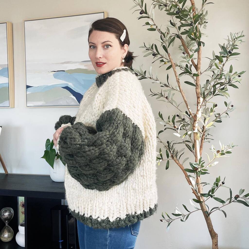 One more…look at those bubble sleeves!! I learned so much knitting this… mainly the bubble stitch and 1x1 twisted-v ribbing. I only knitted one cardigan and one sweater before attempting this project. 

And yes – I already bought yarn for my next sweater. 🧶🥰

I used <a href="/lio/">Lio</a>…