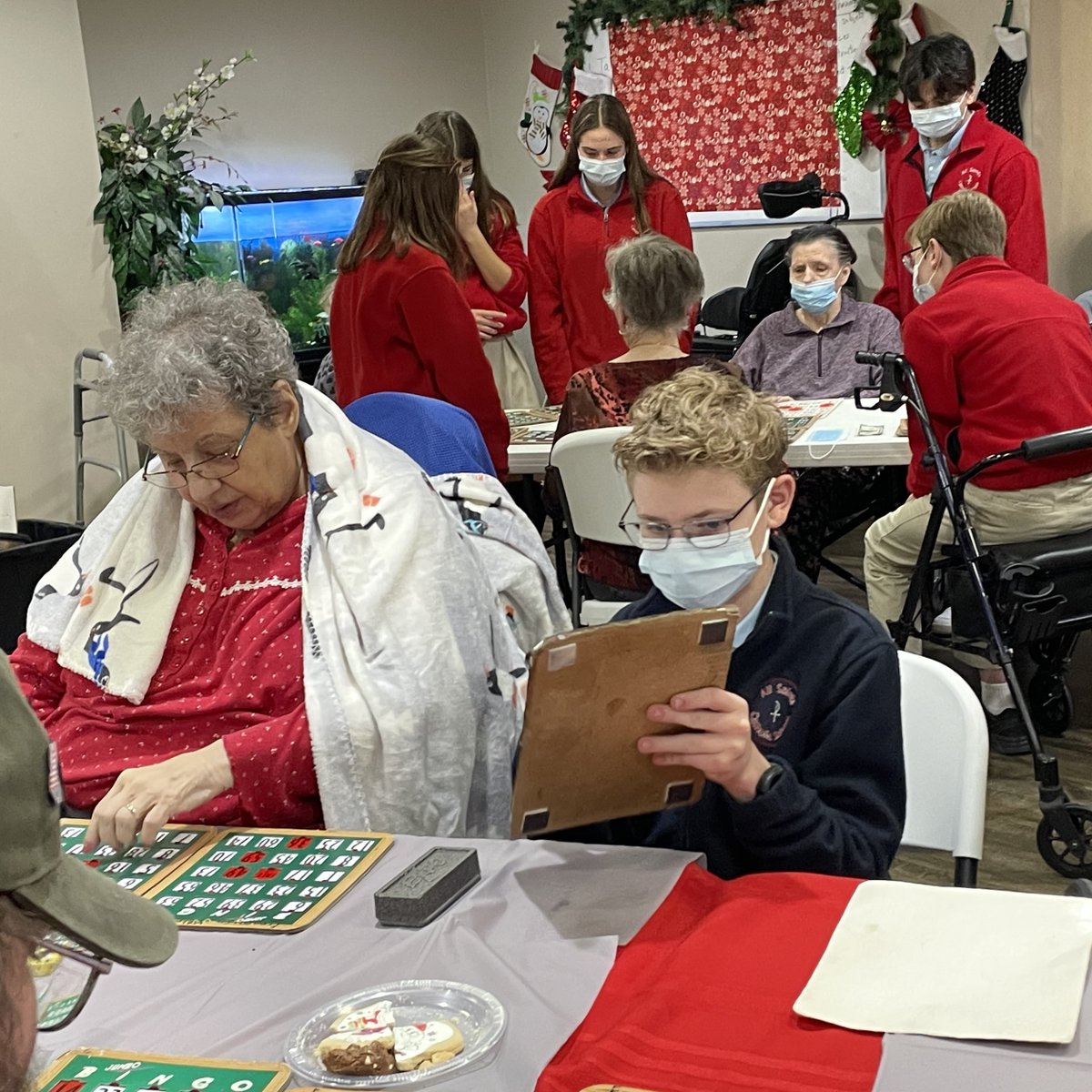 allsaintsba's tweet photo. Our 8th grade NJHS members played Bingo today with the residents of Franciscan Villa. #CatholicCharities #Advent https://t.co/Yue9SkKlnG