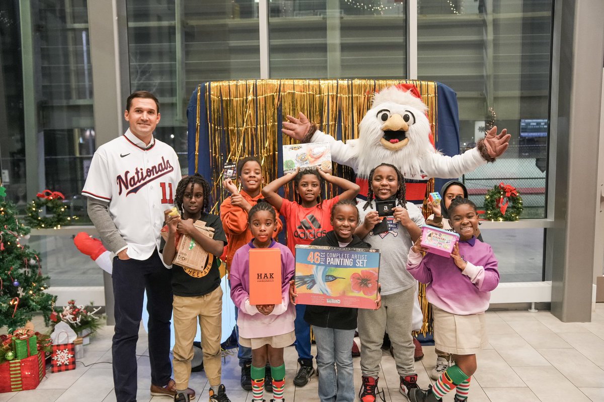 Nats4Good's tweet photo. Yesterday, #NatsAcademy Scholar Athletes were joined by Ryan Zimmerman and @ScreechTheEagle at our annual holiday gift drive.

Since 2014, the local office of @Mintz_Law has supported this tradition. Over 100 kids received gifts this year. 

🔗https://t.co/utidWUMx1Q | #Nats4Good https://t.co/kwOhi94LSA