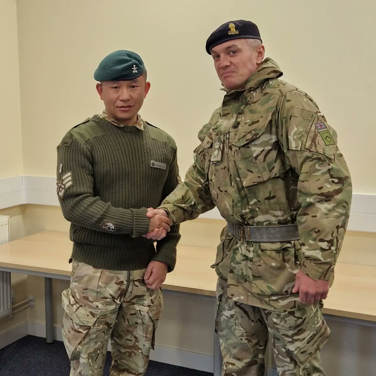 Comdt RSME and CI REWW presenting coins for excellence to WO2 F and Sgt R.