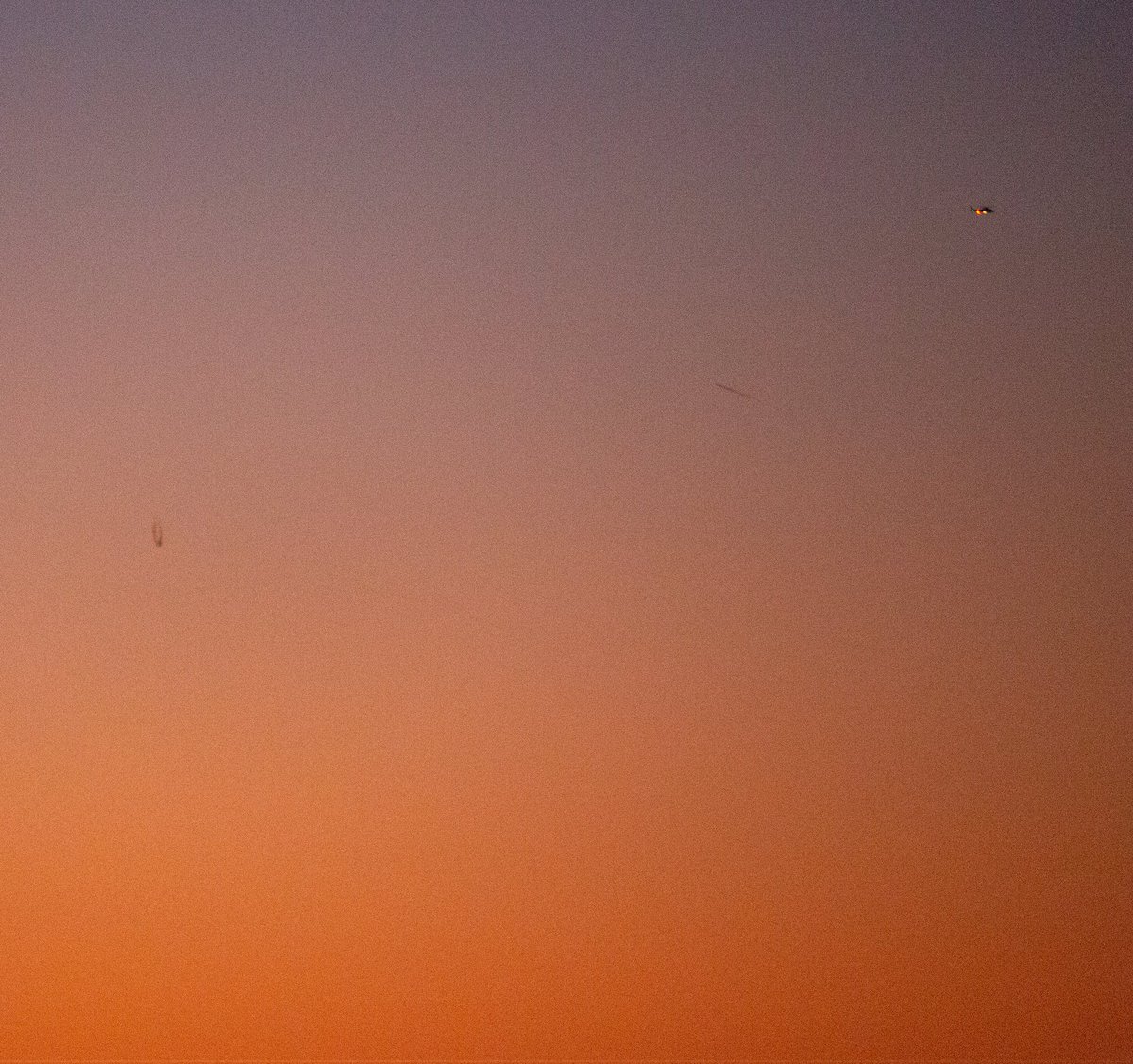 JatthewMenkins's tweet photo. Here's a part of another shot taken a few moments before and some zoomed crops. You can see a military type helicopter (i think) to the right, which was buzzing around, and then another sort of black streak nearly which is only in a couple of other shots. https://t.co/B6Teb2nxyu