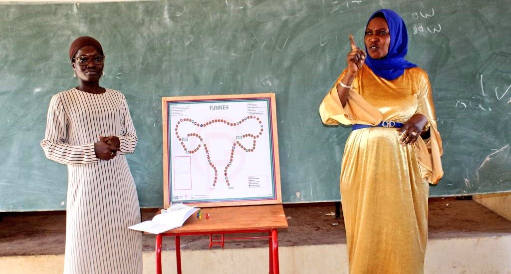 GirlsPrideGam's tweet photo. Teamwork and passion are the 🔑 to success. 
Mrs. Sally volunteered as a Sign Language interpreter for her students during our training session. Without her support, our training will not be successful.
@MobseTheGambia
#FunnehBoardGame 
#LearnThroughGaming 
#LeaveNoOneBehind https://t.co/vQmXae6EC2