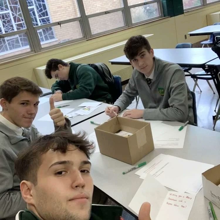 SJRHighSchool's tweet photo. 🙌 to Timmy Doherty '23 and Charles Wicker '23 for spearheading efforts to write 250 🎄 cards to residents at Chelsea Senior Living.

The duo set up shop with 20 fellow Green Knights and wrote out their messages after school, delivering them this week.

#think #lead #serve https://t.co/dOGGEC603x