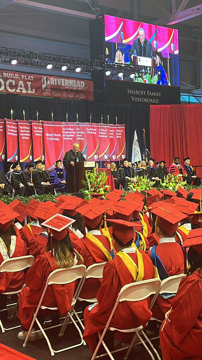 Wide shot of Senate Majority Leader Chuck Schumer addressing an audience of students at commencement in the Island Federal Arena.