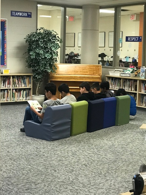 Our students are enjoying the new library chairs here at WTT. This group of children was really engrossed in their reading :)