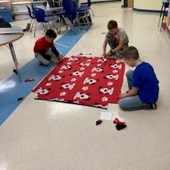 SunriseValleyES's tweet photo. Just before the winter break, our sixth graders made fleece blankets to donate to Corner Stones in Reston. #SunriseValleyShines https://t.co/UL3lvfZ6D3