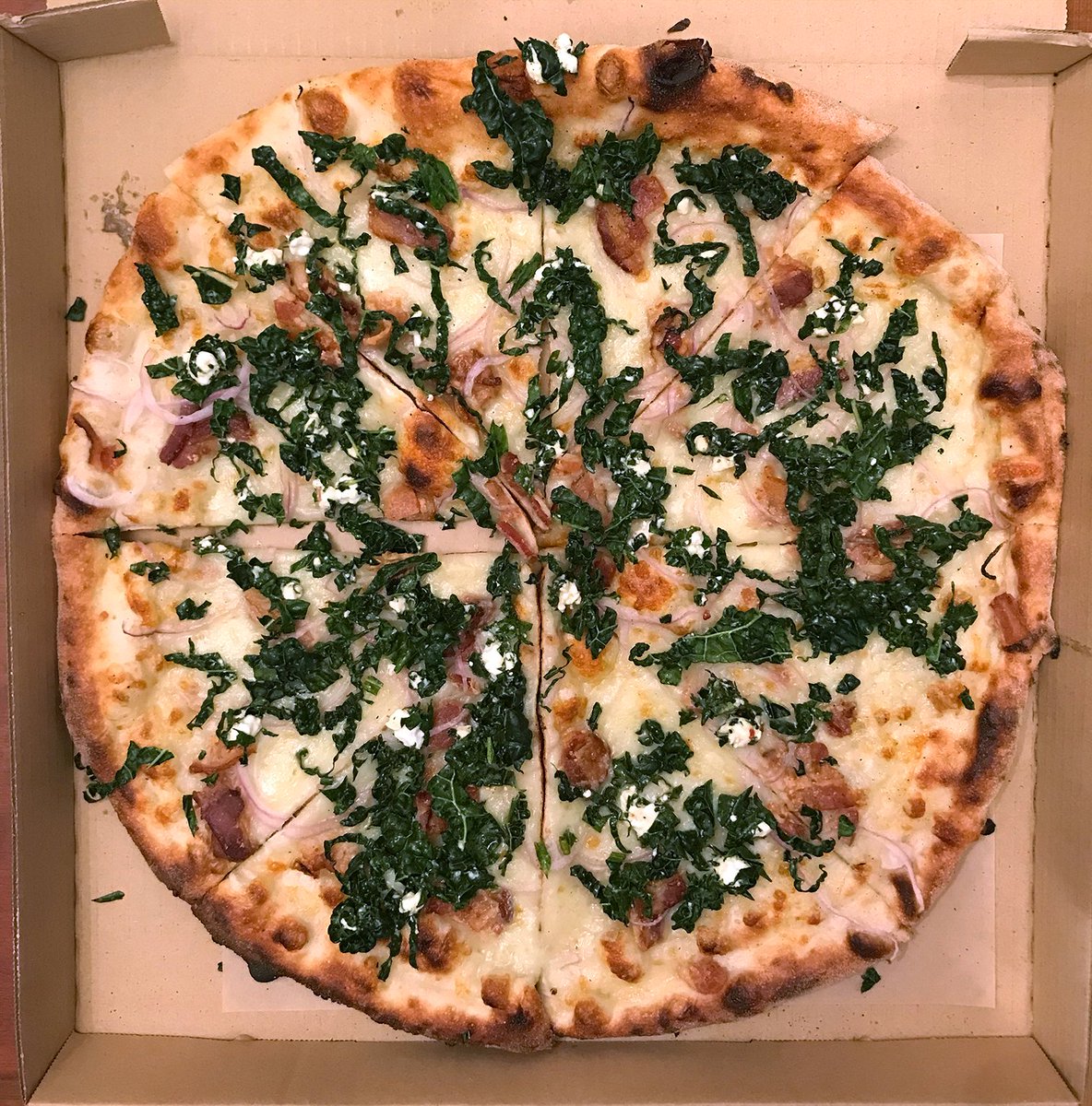 New special <a href="/SolsticePizza/">Aaron Baumhackl</a>: Kale, bacon, onions, feta, red chile flakes on a garlic/olive oil/mozzarella base. Perfect to top off yesterday's planting trip. The red pepper adds just a hint of spice.