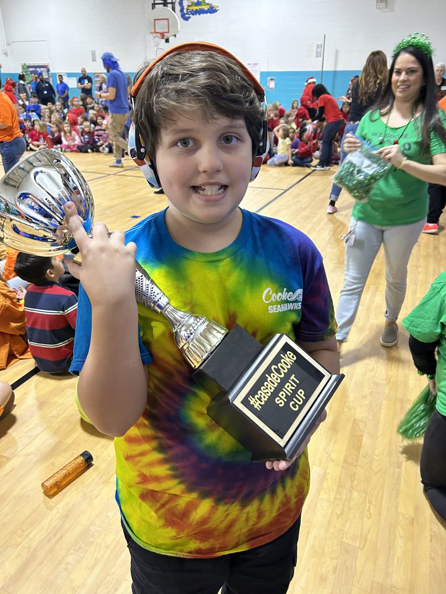 FosterKindness's tweet photo. look at our guy bringing home the spirit cup for Casa de Seguro 🧡 the amount of joy that radiated from this boy after his name was called and he got up to claim his trophy in front of the whole school makes all of our hearts so happy 🥰 #CasaDeCooke https://t.co/gME3NptuxZ