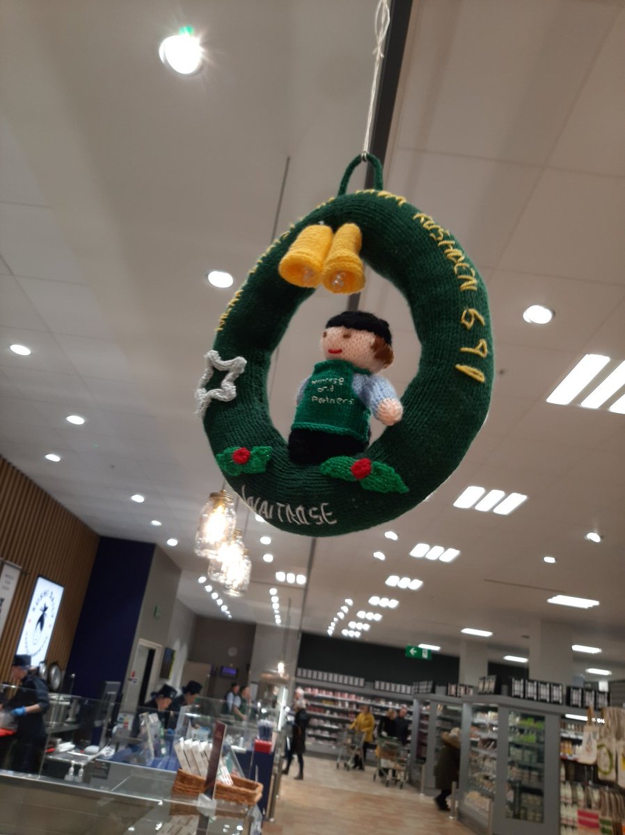 Waitrose Rushden . Festive yarn bombing by the lady on the cheese counter.