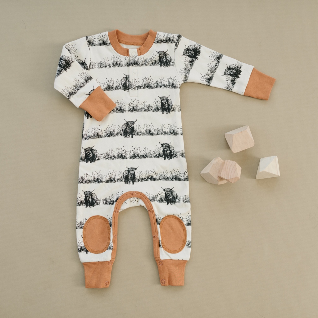 Our Highland Cow print is fully stocked on our website! This cozy outfit features knee patches and is made from 100% organic cotton like all our products.