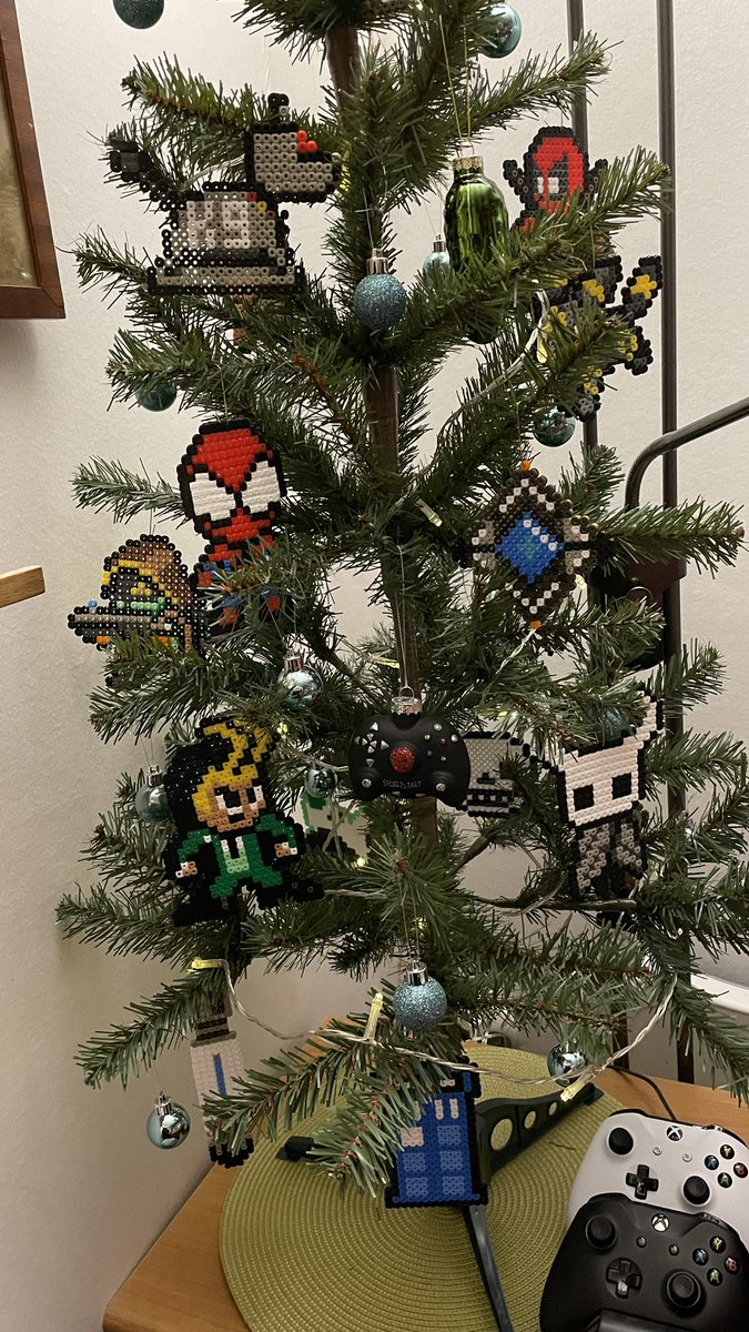 xPickles77x's tweet photo. Finally put up our very nerdy little Christmas tree today. In this house we geek hard! 😁👍
The #hamabead ornaments are made by me and the kids and represent a lot of the nerdy things we like 😊 https://t.co/eZYI2WbNsP