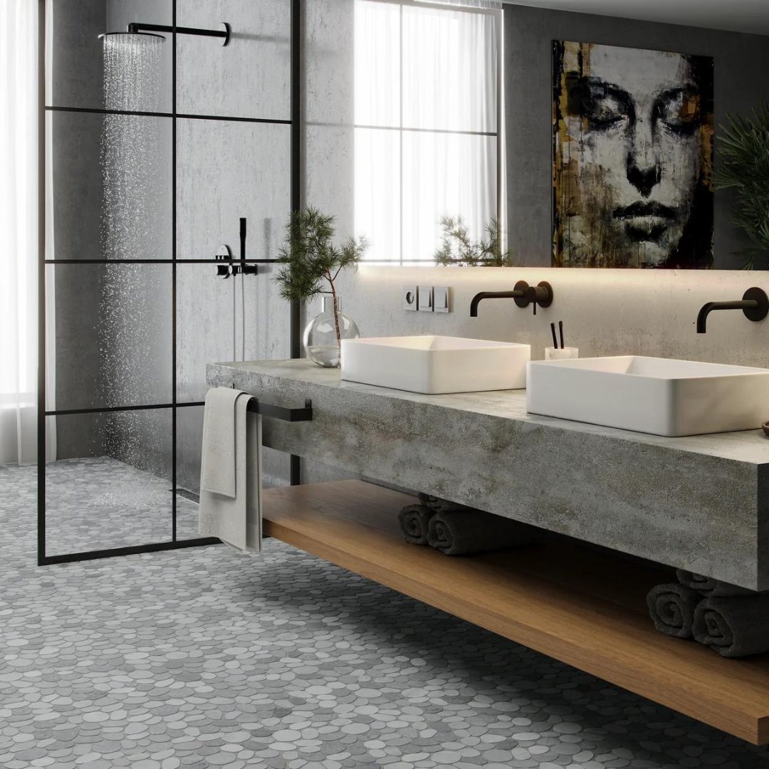 The industrial look in bathrooms is part of this remodeled home. Spindrift Marble Island Mist Honed gives an earthy vibe to this modern bathroom.

#bathroomvibe #modernbathroom #moderndesign #industrialbathroom #islandstone #islandstonetile #tileadventure #remodel #interiordesign