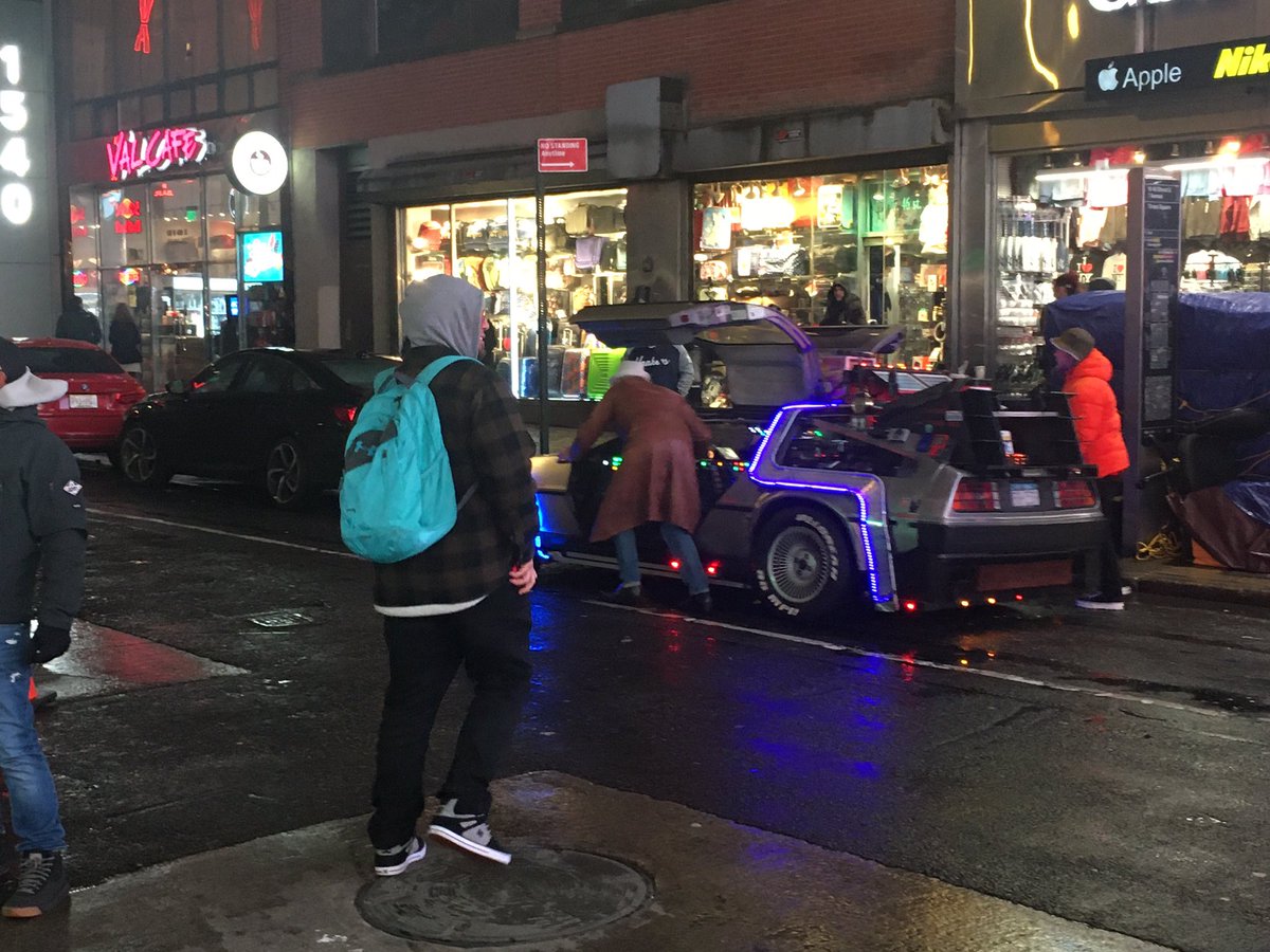 Aster_dexmint's tweet photo. Back to Future Delorean broken down in Times Square with Doc Brown pushing it to the side. Sad end to a DMC12 @MotorWeek https://t.co/2TyfDTsYqO