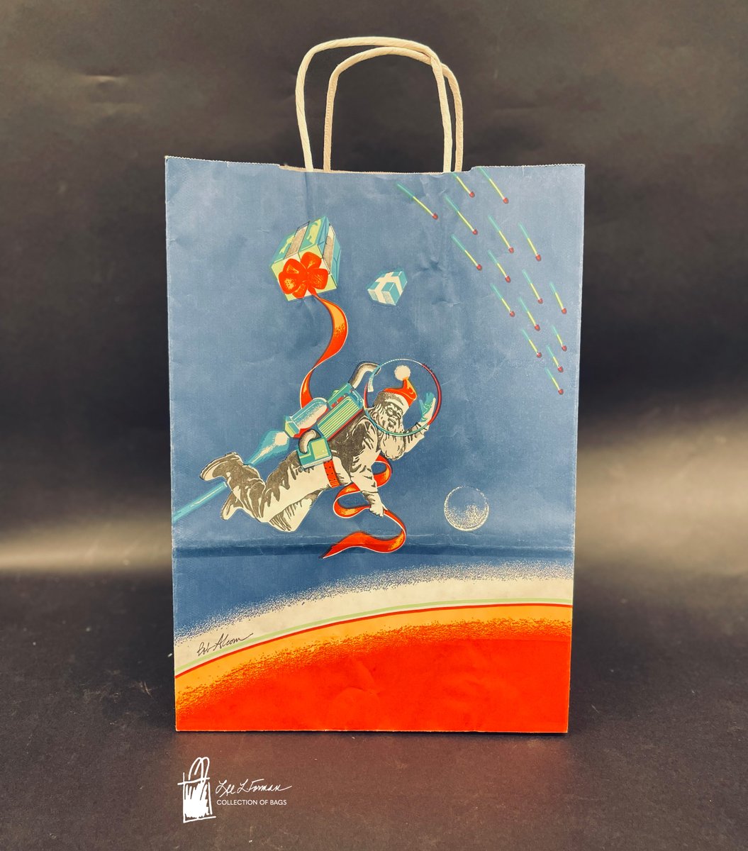 358/365: This 1979 bag from Bloomingdales 'Christmas at the Dawn of a Decade' campaign features Santa Claus delivering gifts while wearing a jet pack in space. The design is signed by Bob Alcorn.