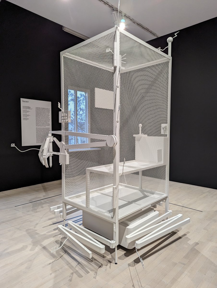 chippy's tweet photo. A mock-up of the 2016 Amazon patent for a workers cage. It was never realised by Amazon, but artist Simon Denny built it. It's currently in the @kunstsammlngnrw K21 museum in Duesseldorf, and it's scary. Thx @dennnnnnnnny BTW https://t.co/1PfHHkVgld