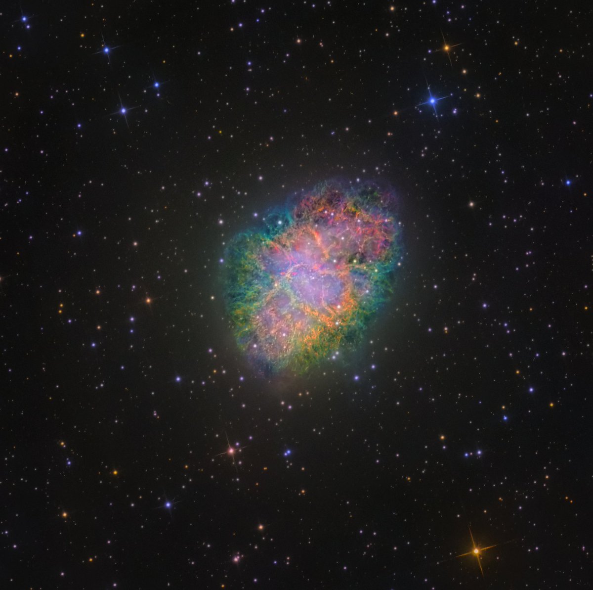 AJamesMcCarthy's tweet photo. I captured a photo of a SUPERNOVA! This is the Crab Nebula, an outwardly expanding cloud created from a star that exploded in 1054AD (basically yesterday in a cosmic sense). The colorful display shows how varied the composition of this object is. https://t.co/pNf54AgMqM