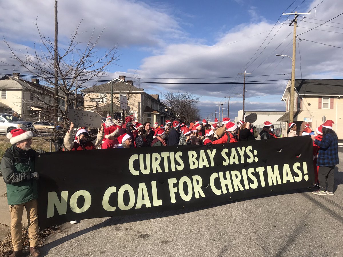No coal for Christmas! Dozens of Santas rally with <a href="/BaltimoreSouth/">South Baltimore Community Land Trust</a> and <a href="/XRBaltimore/">Extinction Rebellion Baltimore</a> against the fossil fuel economy, on a wintry Saturday afternoon in Baltimore.