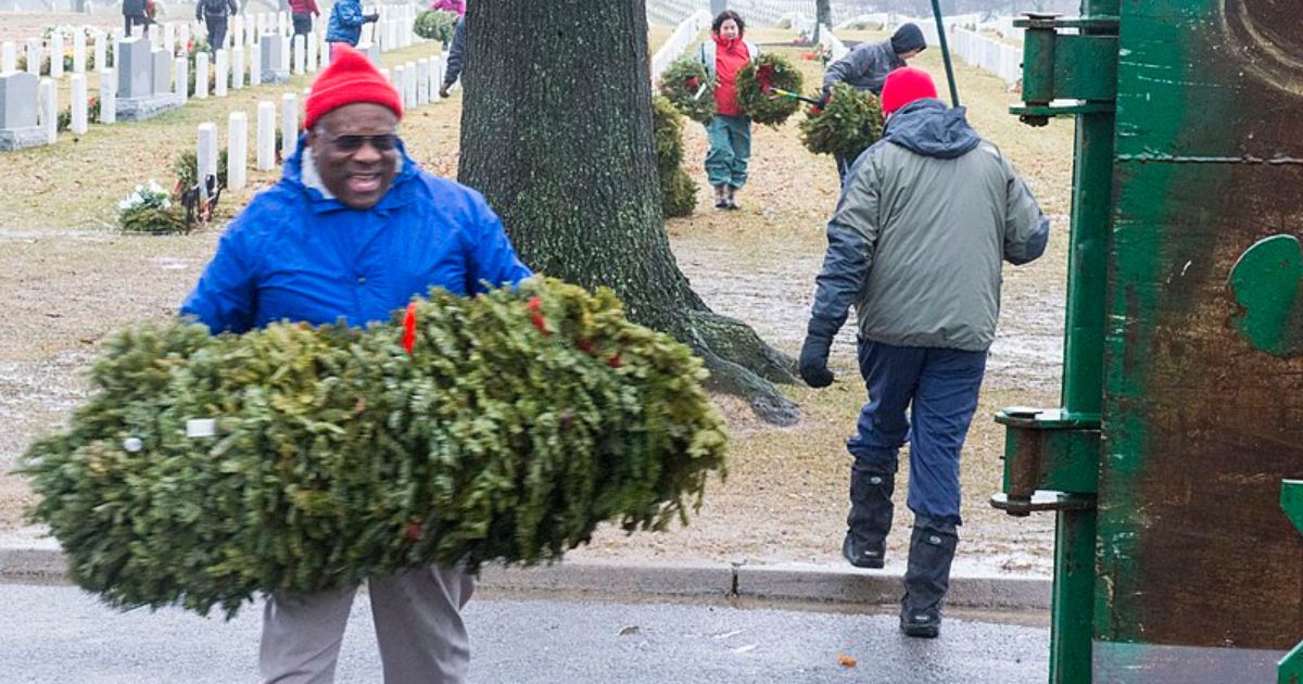 ElectionWiz's tweet image. REPORT: Justice Clarence Thomas spotted quietly laying wreaths with all the other volunteers at Arlington National Cemetery for the Wreaths Across America event to honor those who made the ultimate sacrifice.