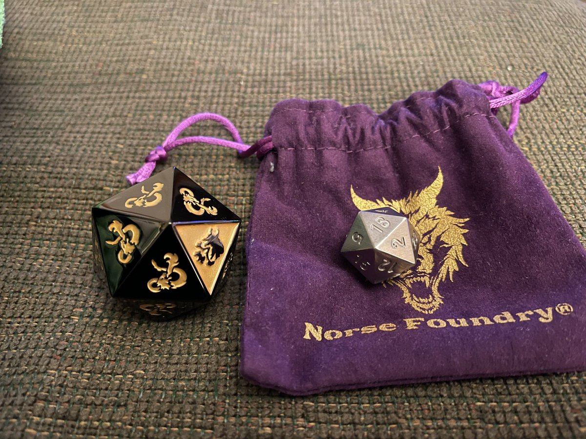 This zinc alloy boulder from @deathsaves weighs about the same as my new d20 machined from a block of solid tungsten by @norsefoundry! It weighs about a pound. Literally. What a time to be alive! #dnd #dice