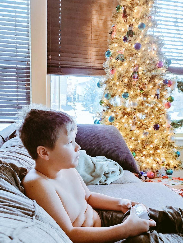 NickMar's tweet photo. Silas and I both started @GodofWar Ragnarok last night. We carted a second TV and a beanbag into the living room. Seemed more logical than yelling back and forth from separate rooms. Christmas break is best. https://t.co/b41XSVwU73